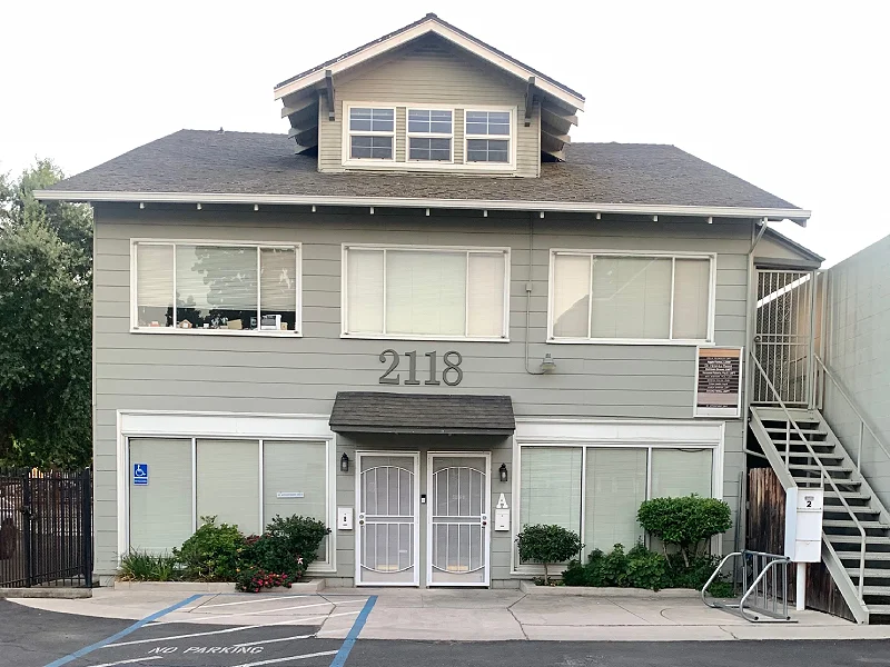 Therapy office building at 2118 P St, Sacramento, CA, featuring accessible entry and landscaped surroundings, relevant for mental health services.
